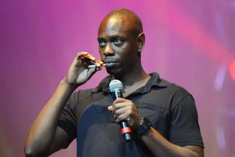 Dave Chappelle Addresses Diddy, Baby Oil & Charlie Kirk In Netflix Special “Dave Chappelle: The Unstoppable…”